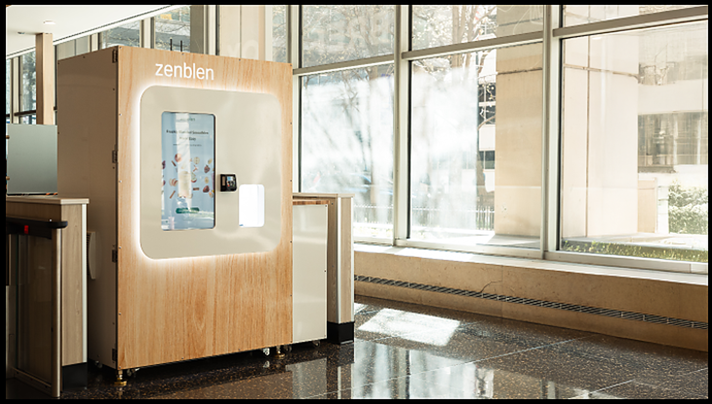 A Zenblen smoothie kiosk in a bright modern building lobby